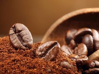 Coffee beans macro on a brown background