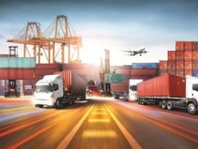 Global business logistics import export and container cargo freight ship during loading at industrial port by crane, container handlers, cargo plane, truck on highway, transportation industry concept