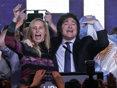 Argentine far-right libertarian economist and presidential candidate Javier Milei celebrates the results of the primary elections with his sister Karina Milei at Milei's headquarters in Buenos Aires on August 13, 2023. The far-right libertarian economist Javier Milei gets 32.31% of the votes in the primaries for the Argentine presidential election, and becomes the protagonist of this election that will contest the former Security Minister Patricia Bullrich and the Economy Minister Sergio Massa. (Photo by ALEJANDRO PAGNI / AFP)