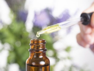 essential oils in front of white background